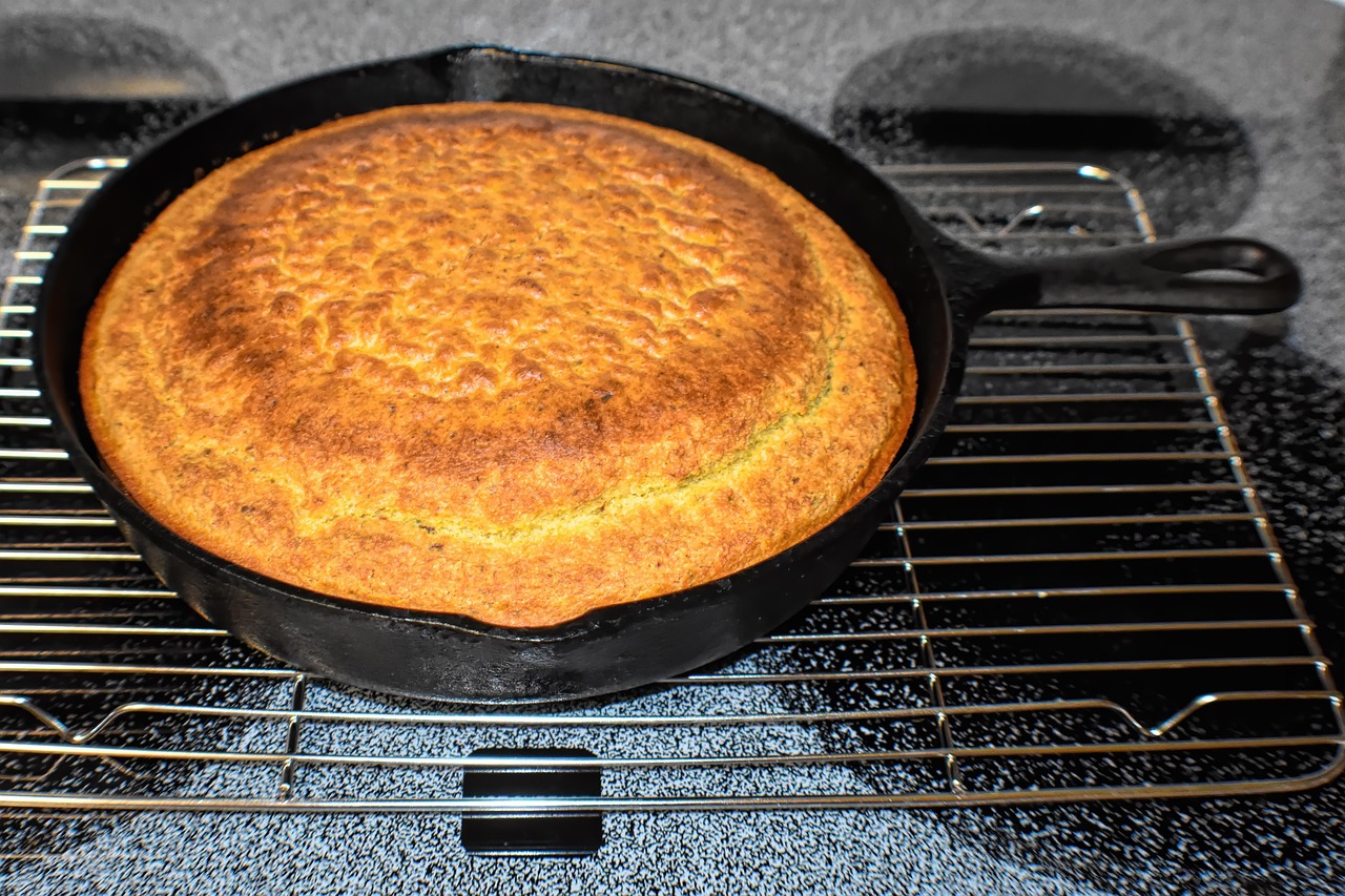 Cast iron cornbread baking in oven