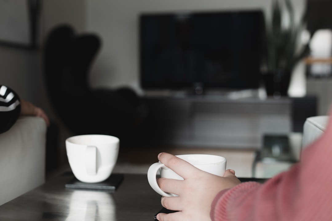 Person enjoying morning coffee at home
