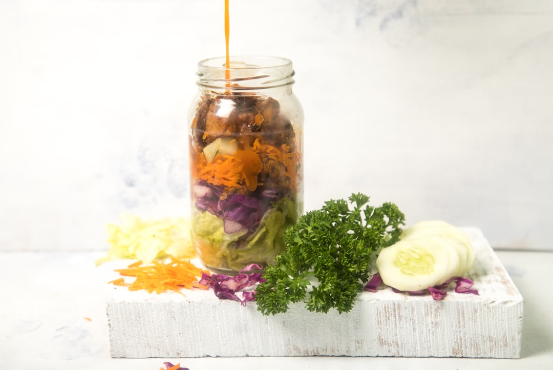 Mason jar layered salad with fresh vegetables