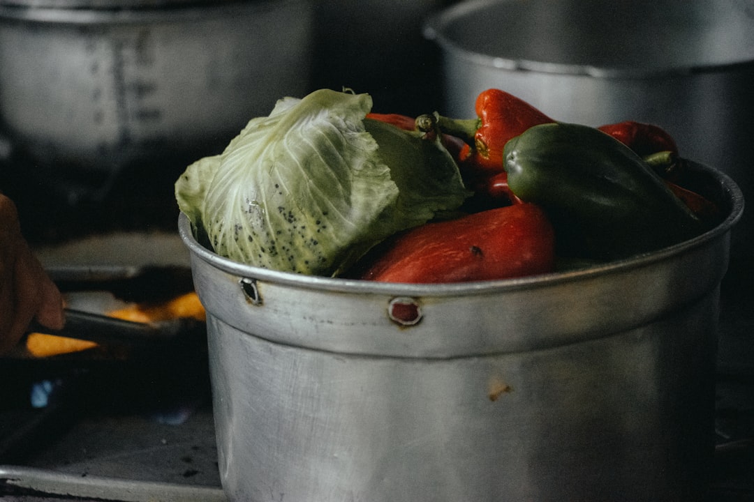 Stainless steel pan cooking vegetables