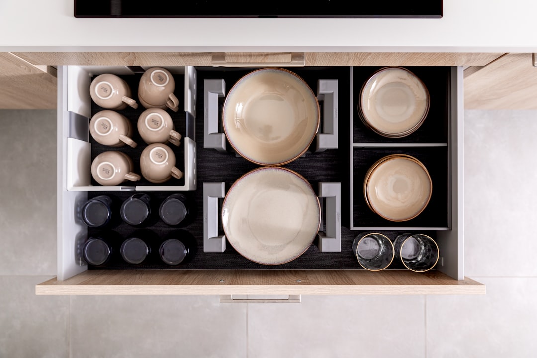 Organized spice jars in a kitchen drawer