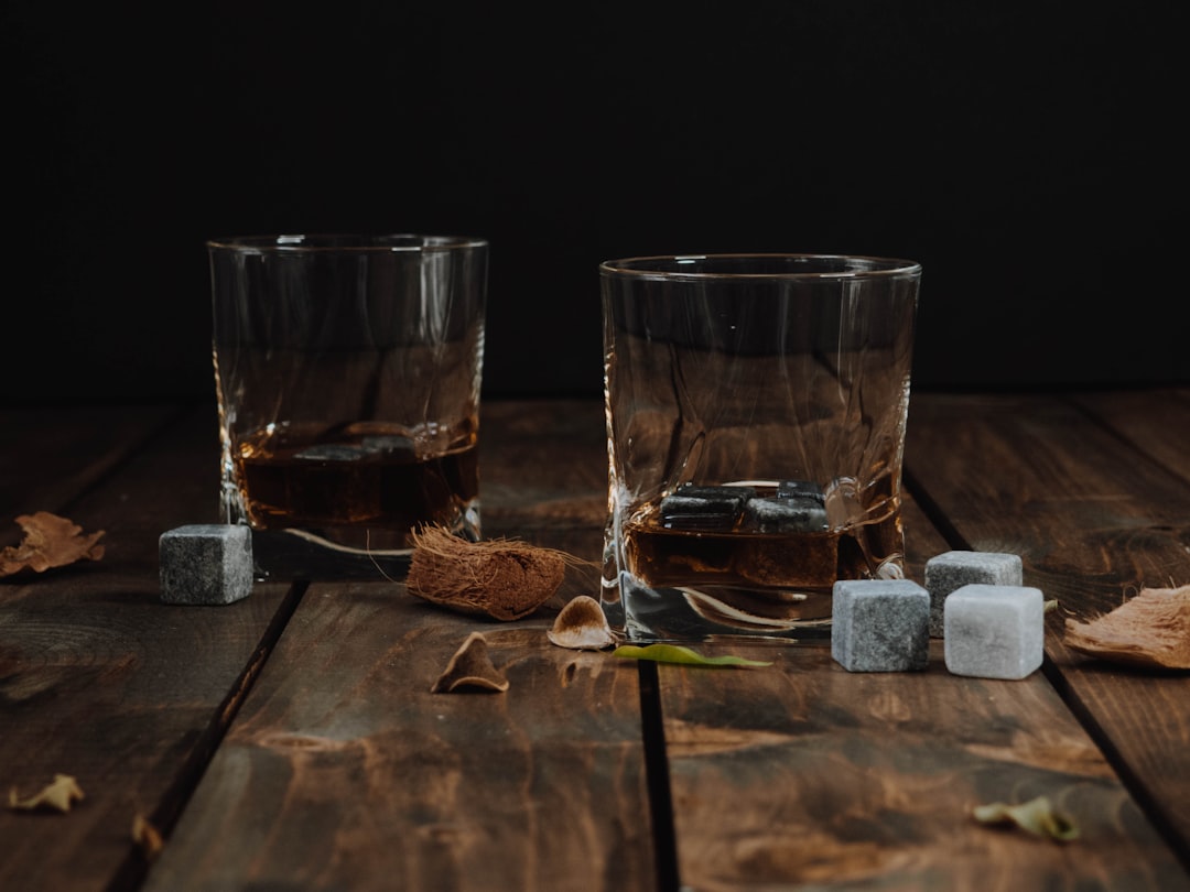 Whiskey glass with ice cube