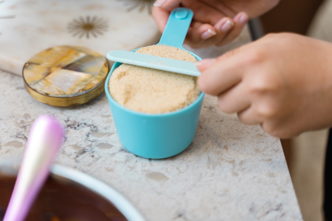 Measuring cups and spoons arranged for baking
