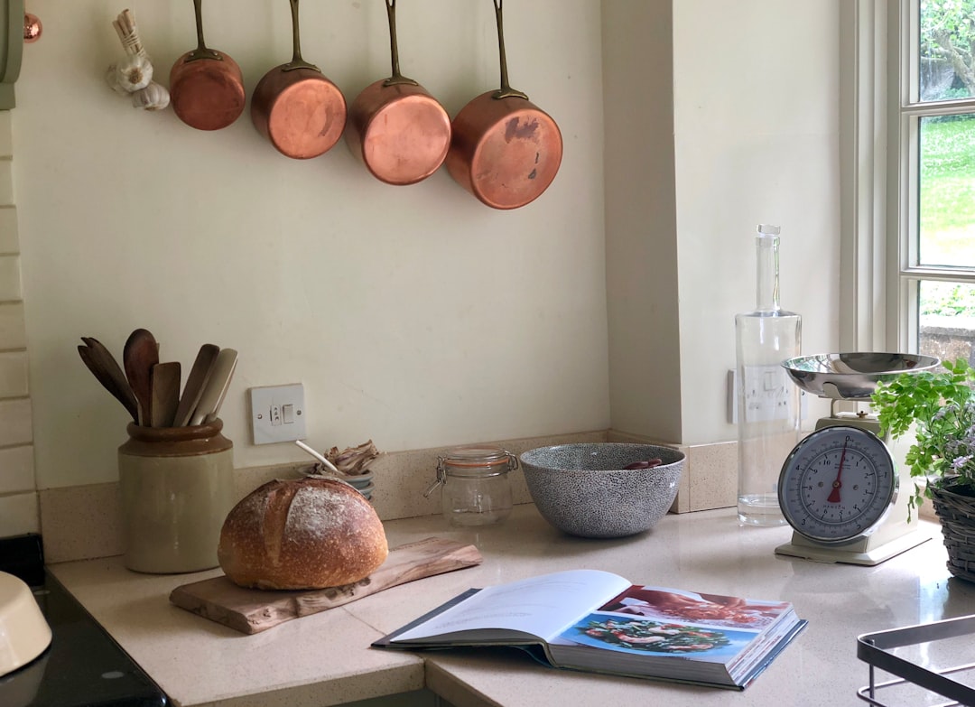 Hand-hammered copper mixing bowls on a kitchen counter