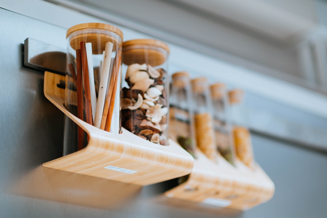 wall mounted spice rack with organized glass spice jars