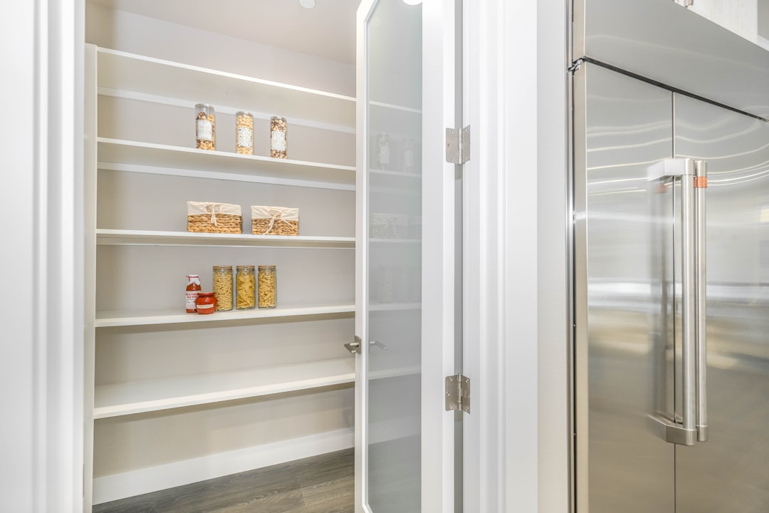 Kitchen pantry with organized shelves and containers