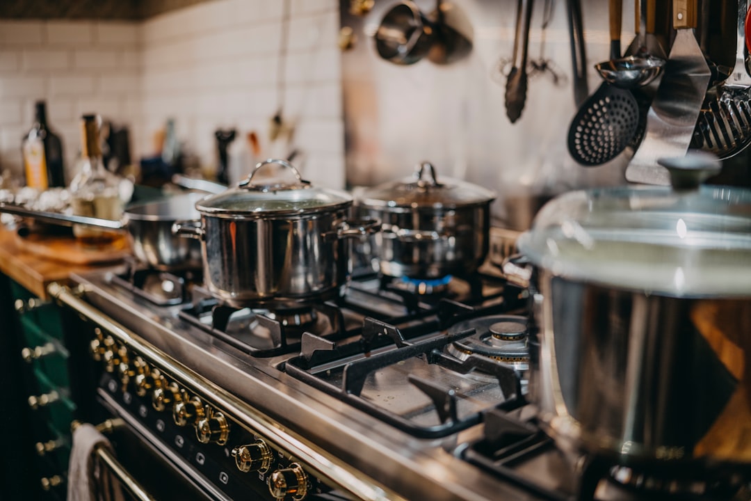Creamy soup being blended directly in a cooking pot