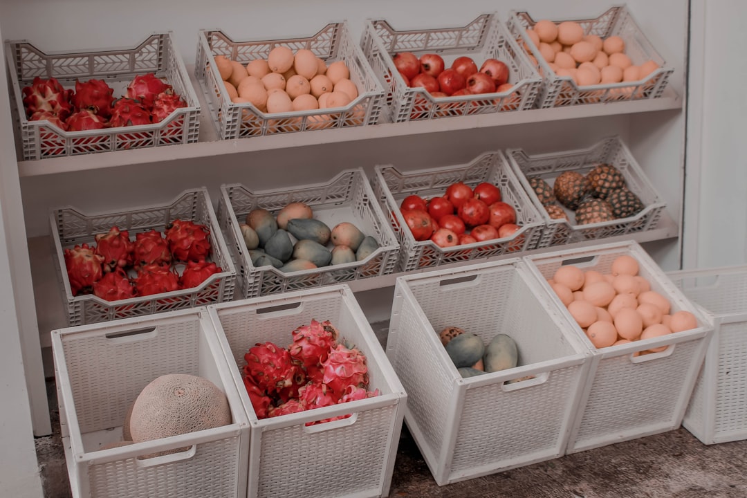 Organized pantry shelf bins with sorted ingredients