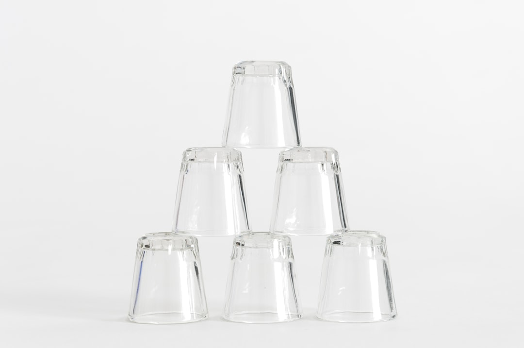Stacked glass meal prep containers showing different sizes and compartments