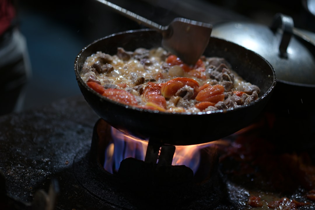 Hot skillet sizzling with golden seared food