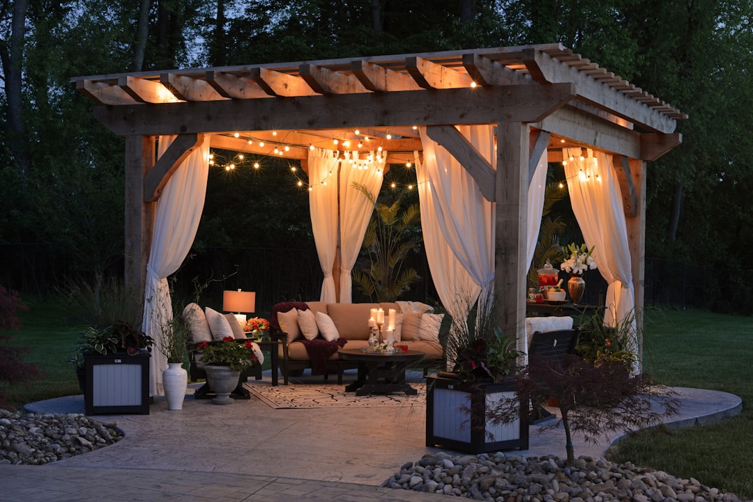 String lights and candles on outdoor patio dining area