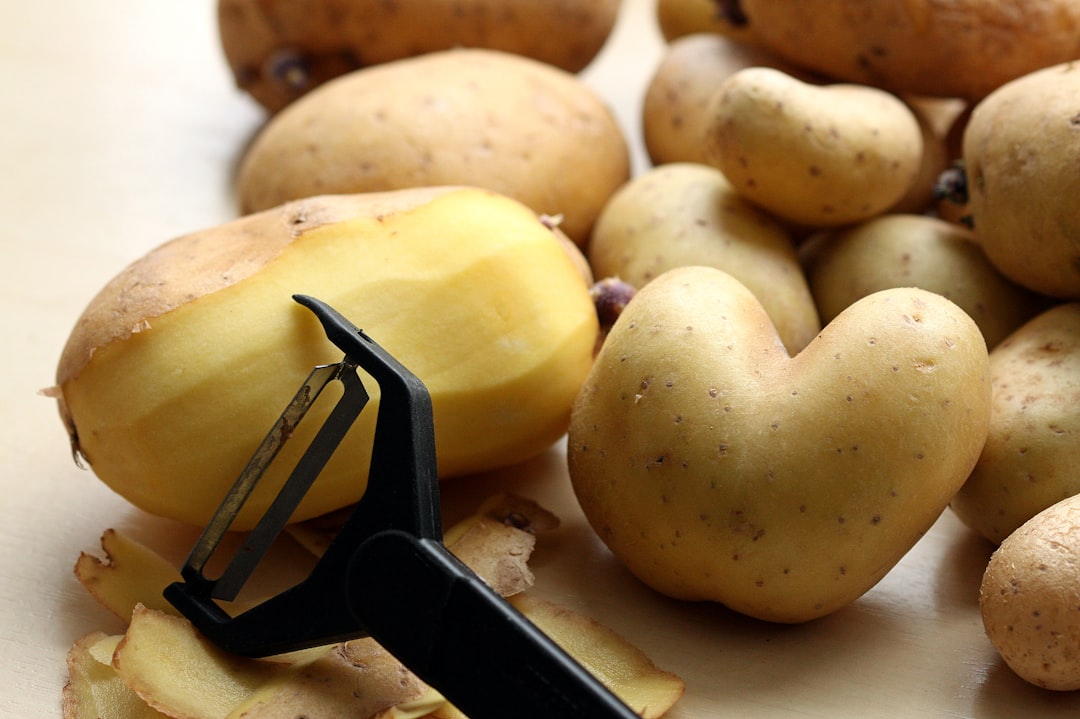 Y-shaped vegetable peeler peeling a carrot