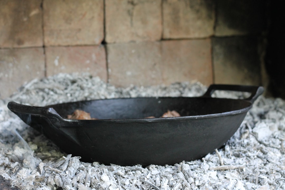 cast iron pan heating on stove burner
