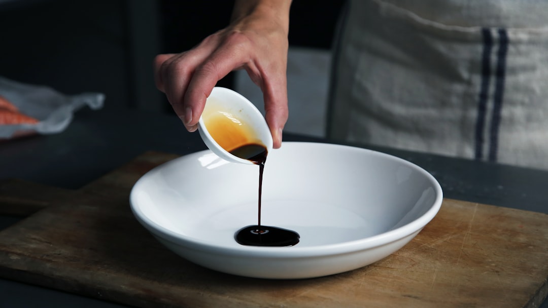 deglazing a stainless steel pan with wine for pan sauce