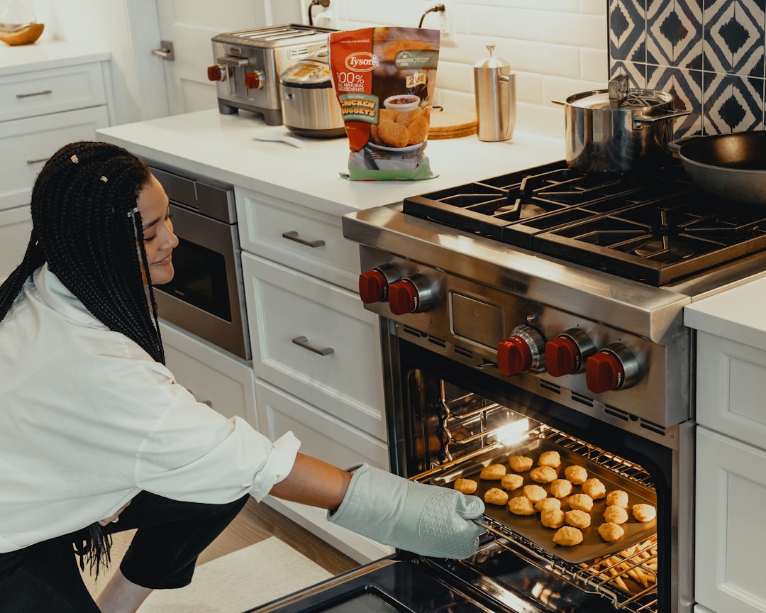 Baking pans and kitchen accessories neatly organized