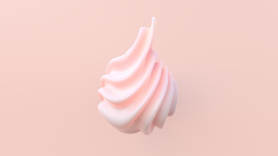 Fluffy whipped cream being beaten to perfect peaks