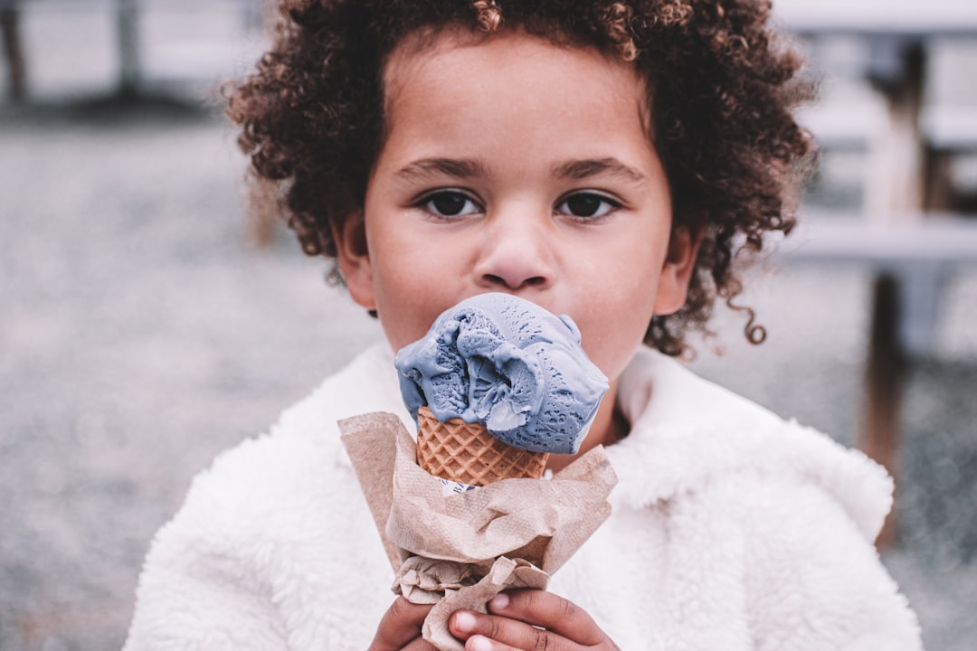 Children enjoying ice cream cones on a summer afternoon