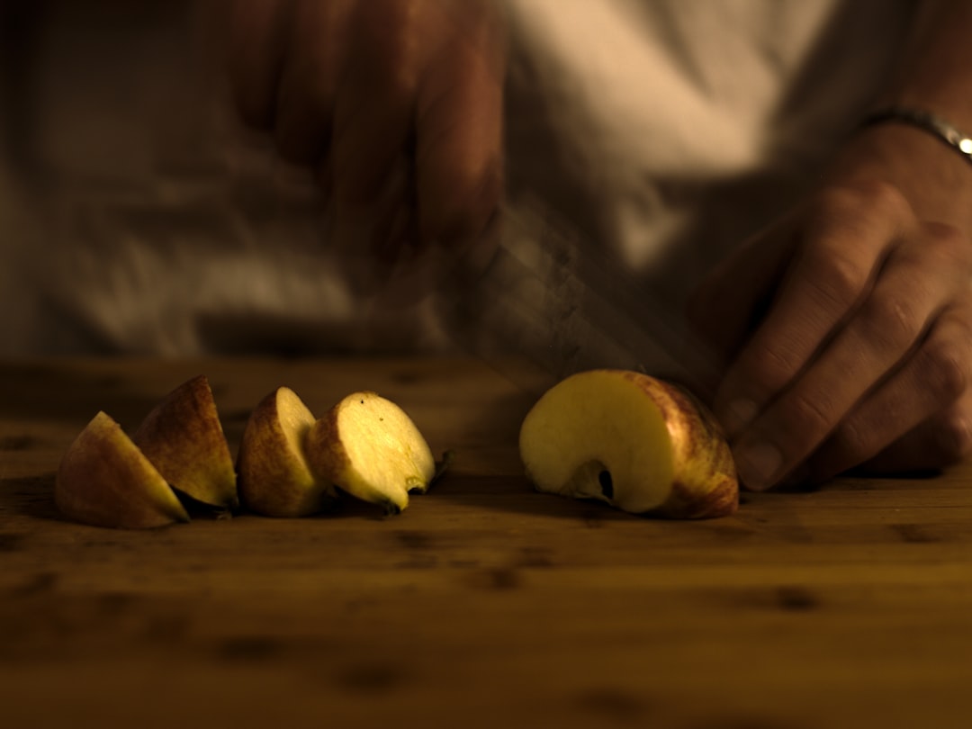 Paring knife being used to peel an apple