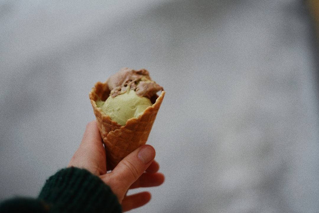 Ice cream scoop with a perfect round scoop in a cone