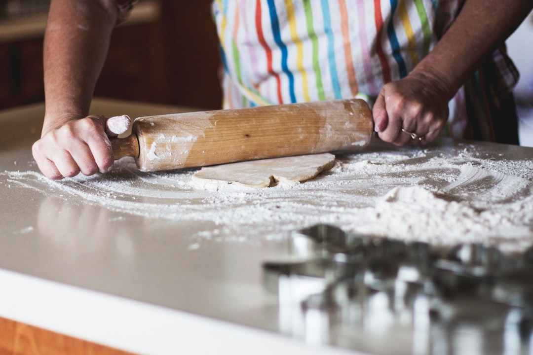 Flour and pizza dough ingredients on a kitchen counter