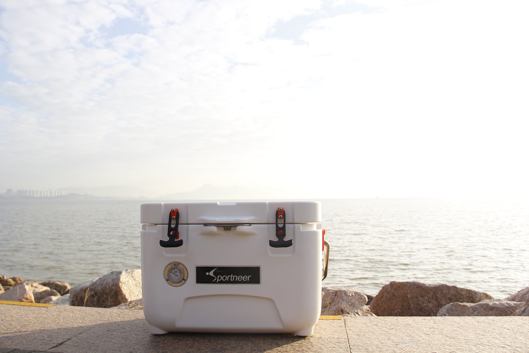 Insulated cooler packed with ice for outdoor gathering