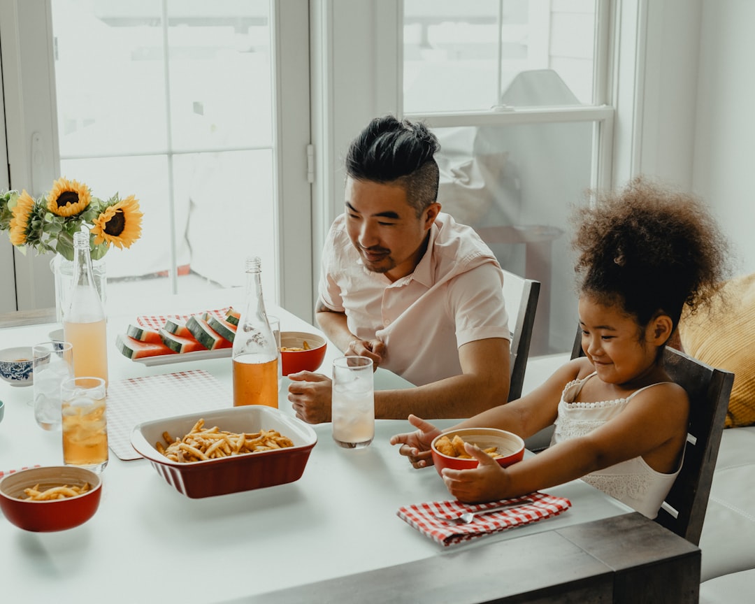 Family gathered around a kitchen dinner table