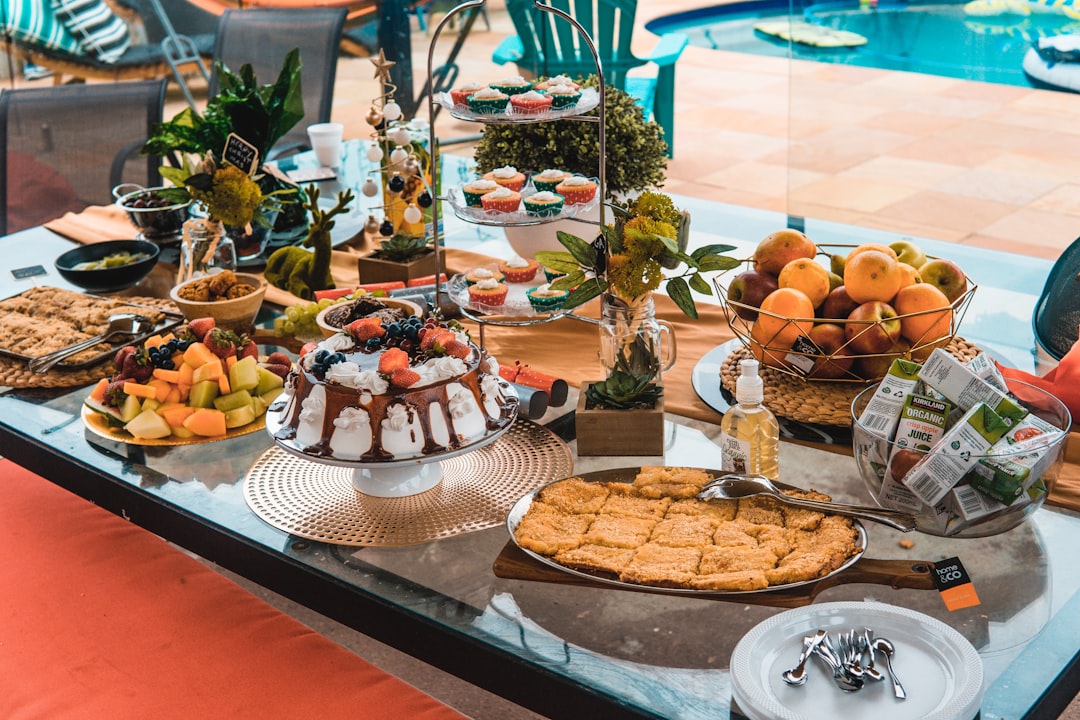 A summer dessert spread with various ice cream toppings and treats