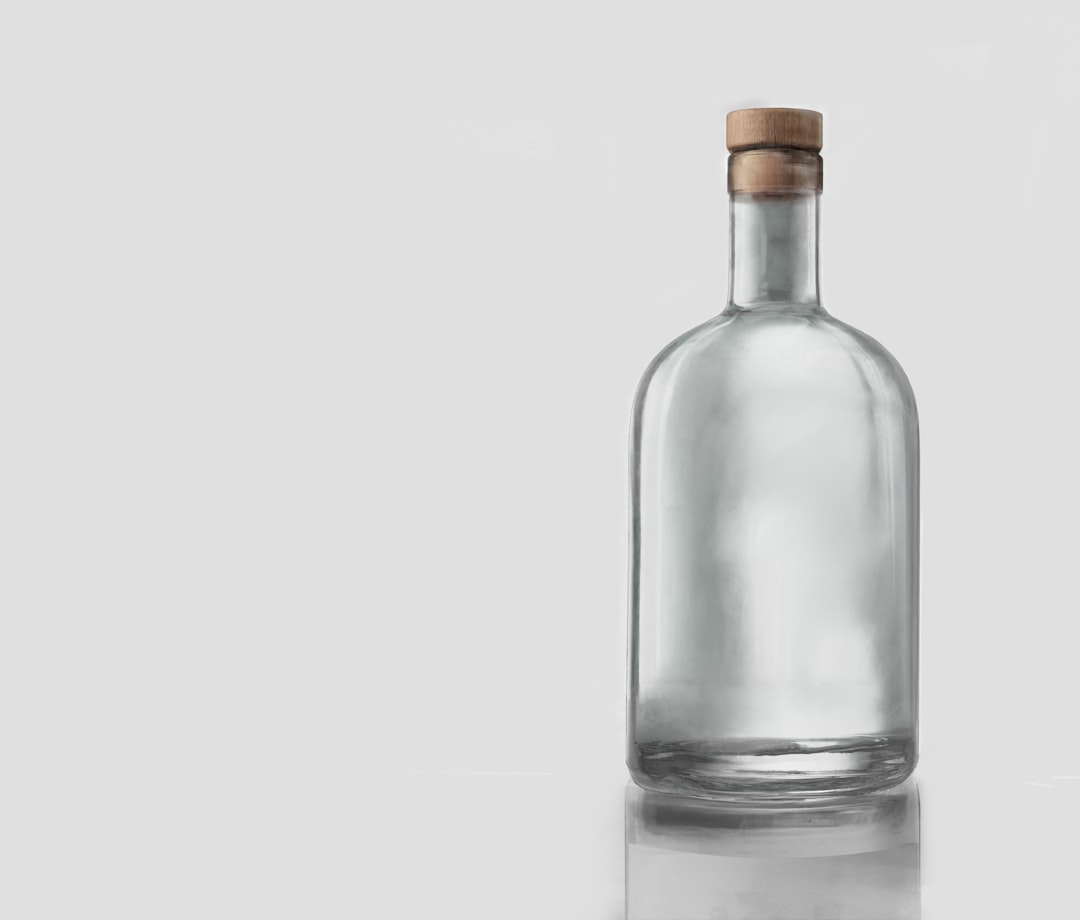 Reusable glass drinking bottles on counter