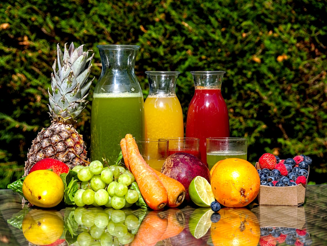 Reusable juice bottles filled with colorful smoothies
