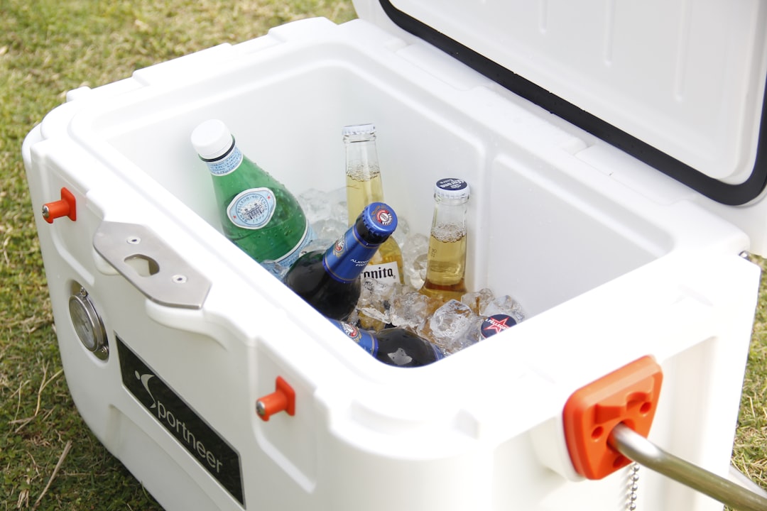 Outdoor cooler with cold drinks at a summer party