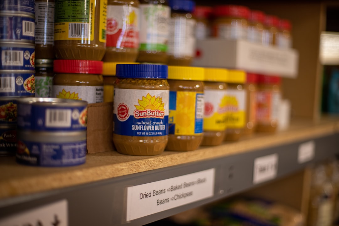 Organized pantry shelves filled with preserved jars and homemade goods