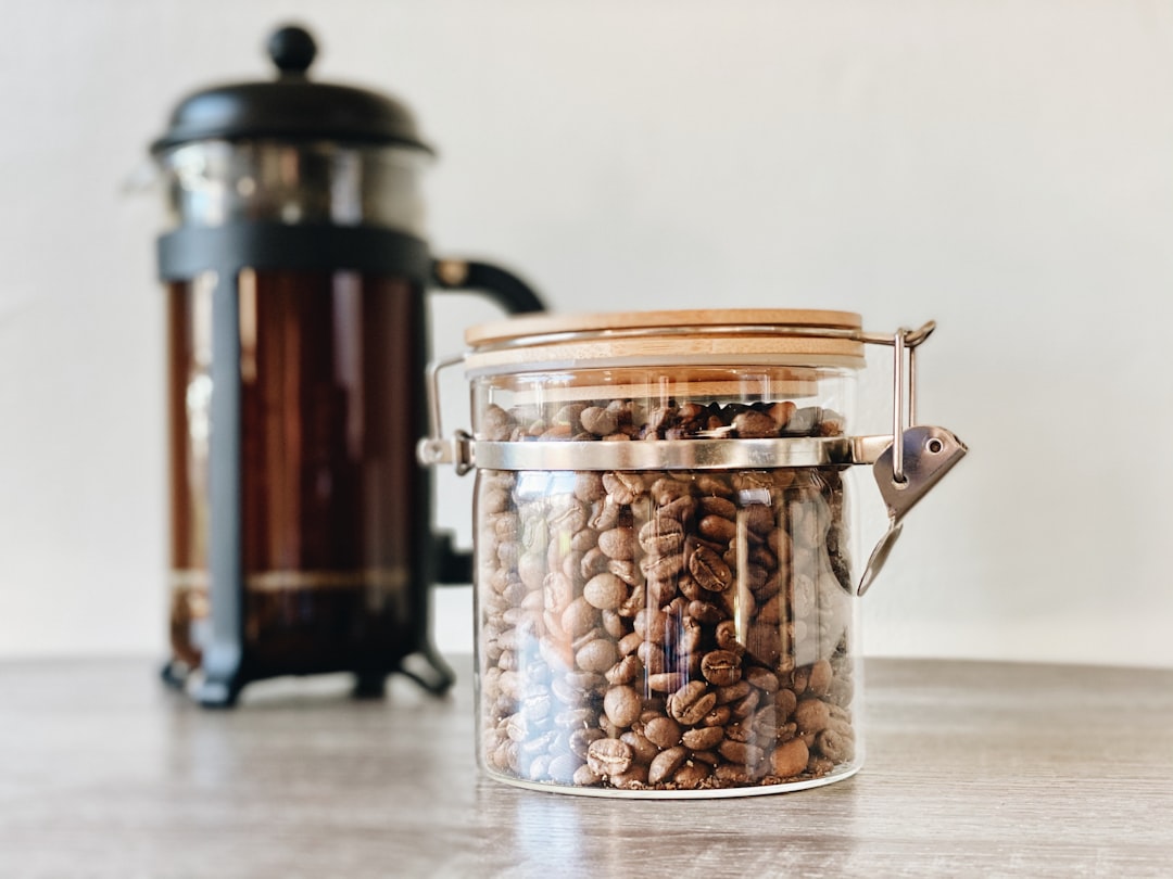 Airtight glass kitchen canisters filled with coffee beans and flour