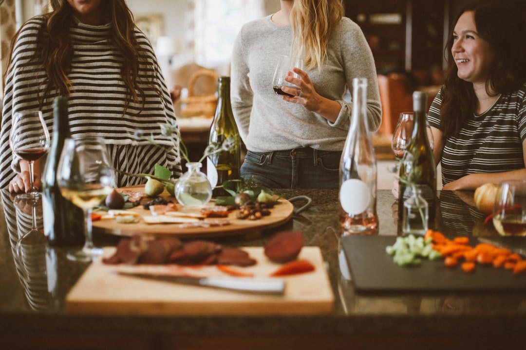 Friends gathering together for summer meal outdoors