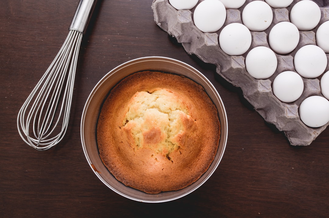 Beautifully baked cake in a tube pan cooling on a rack