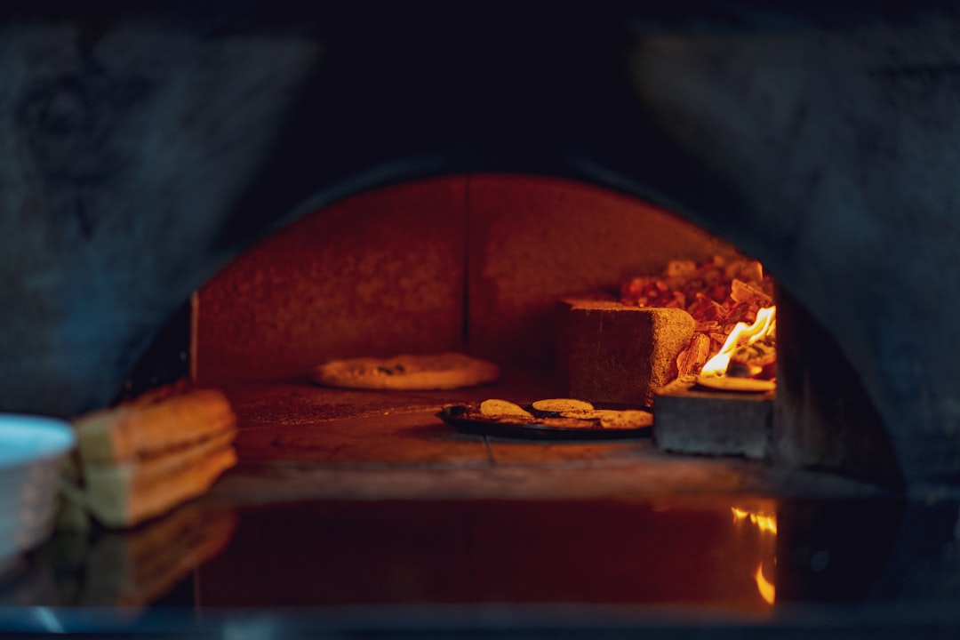 Fresh bread baking on a stone in a hot oven