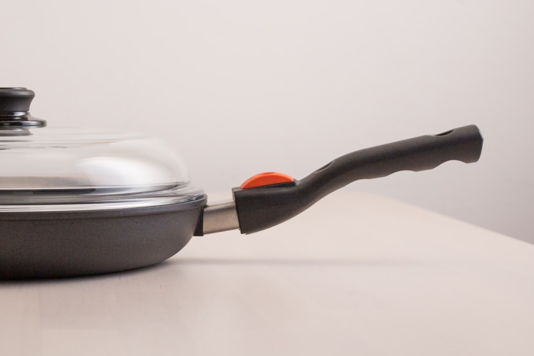 Pan with silicone handle grip