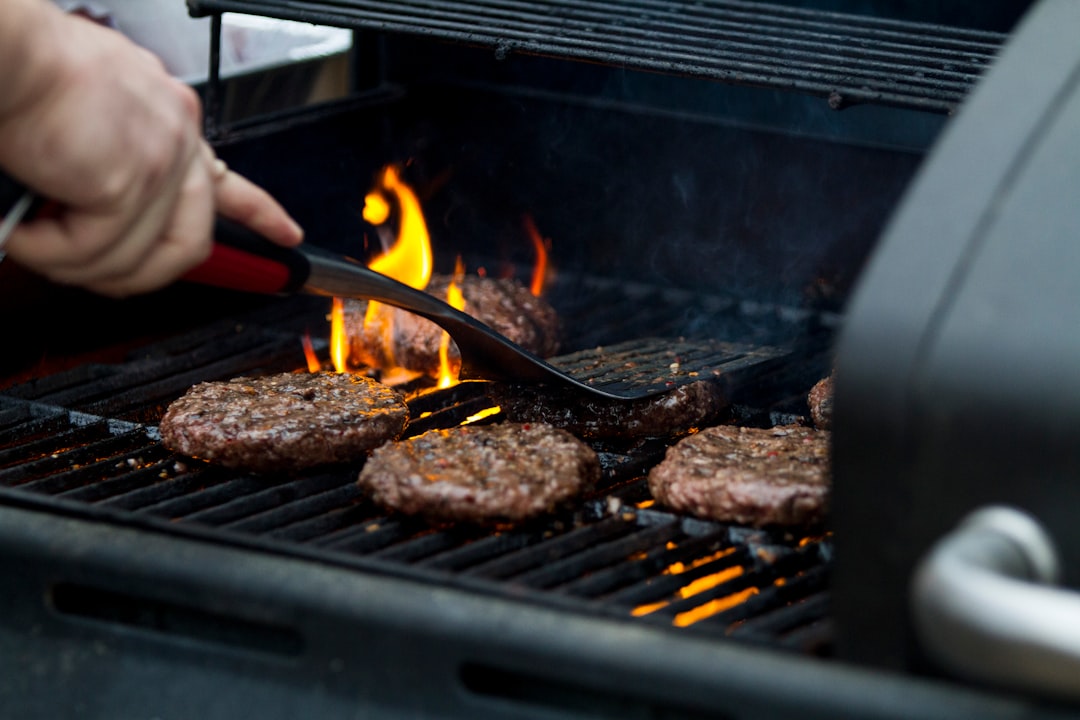 Professional griddle tools and spatulas laid out for outdoor cooking