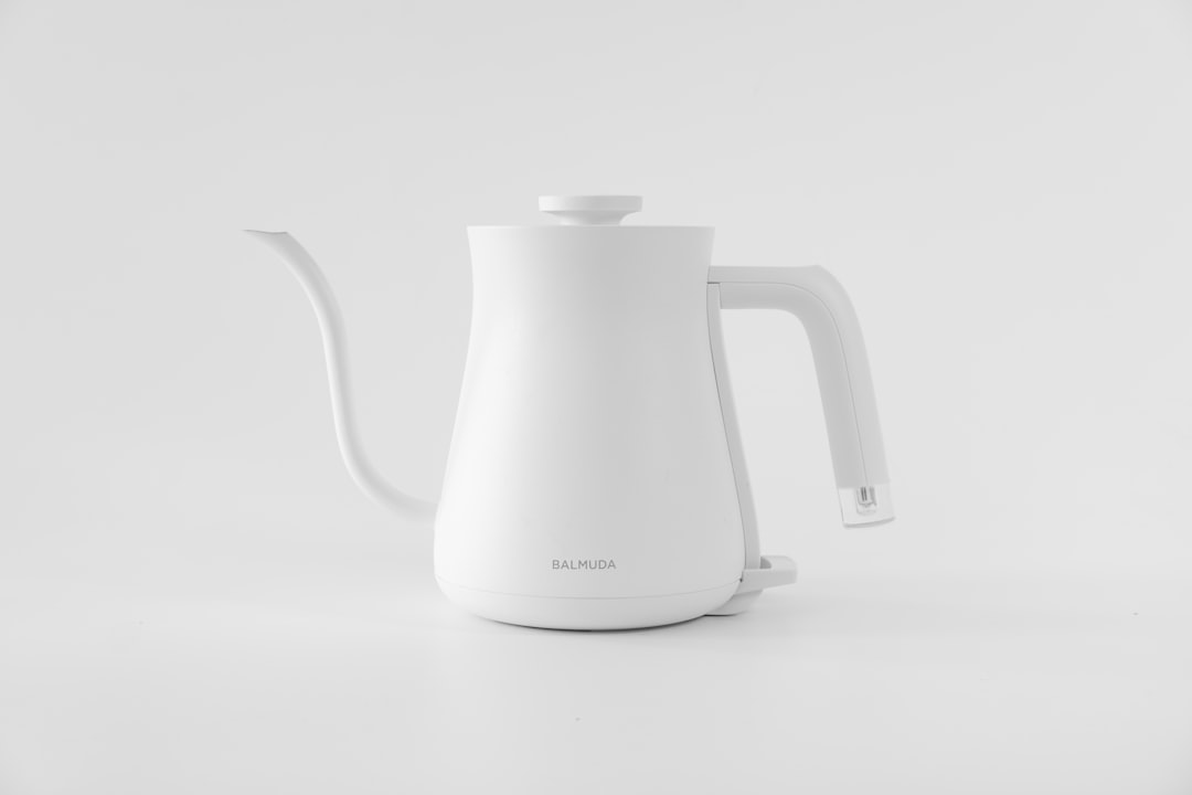Gooseneck electric kettle pouring water for pour-over coffee