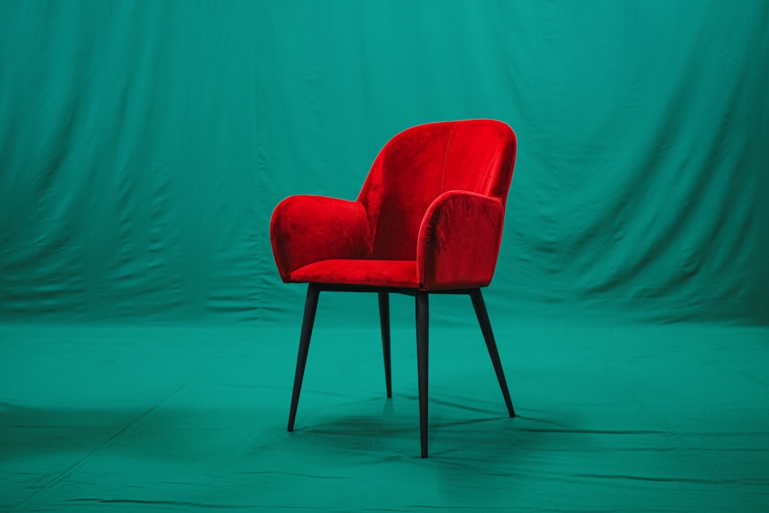 Modern fabric-upholstered dining chairs around a table