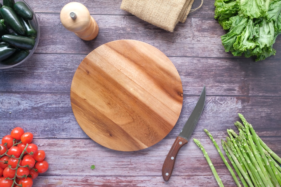 Acacia wood cutting board on a kitchen counter