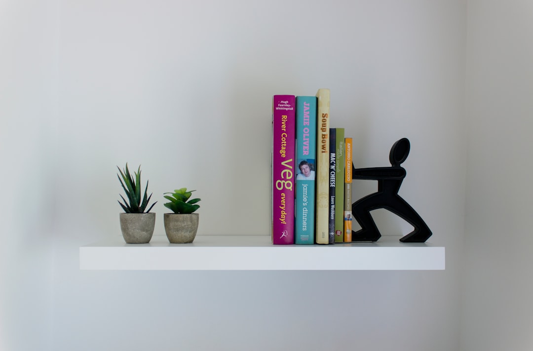 Minimalist floating wall shelf styled with home decor items
