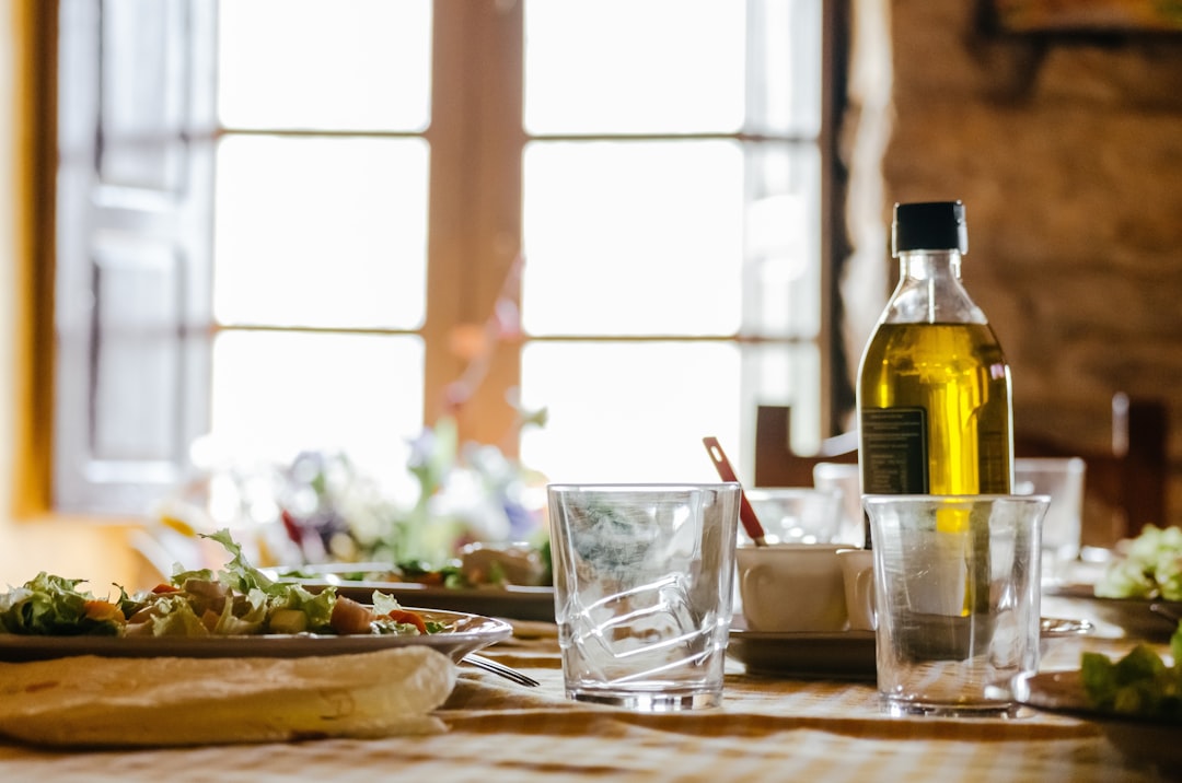 Glass olive oil dispenser bottle with pour spout