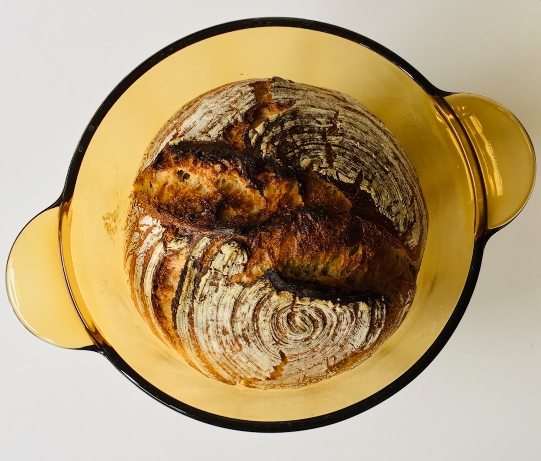 Sourdough starter in a glass jar on a kitchen counter