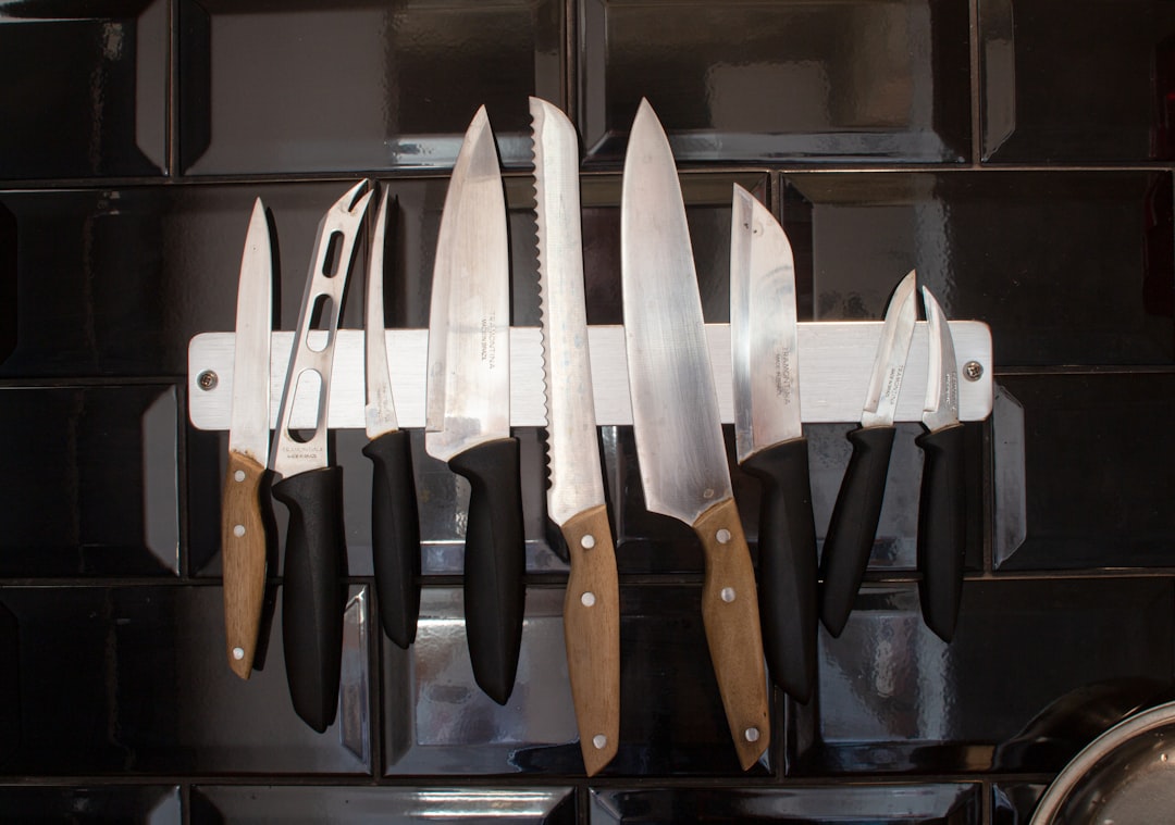 Knife and sharpening steel on a wooden cutting board