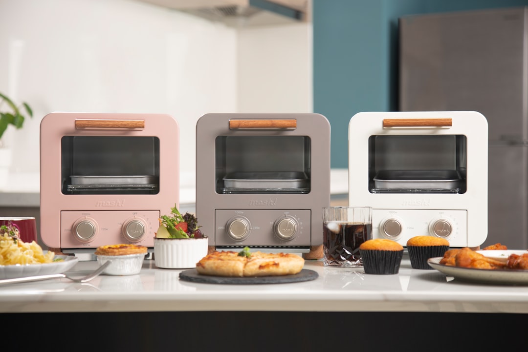 Compact air fryer sitting on a kitchen counter ready to use