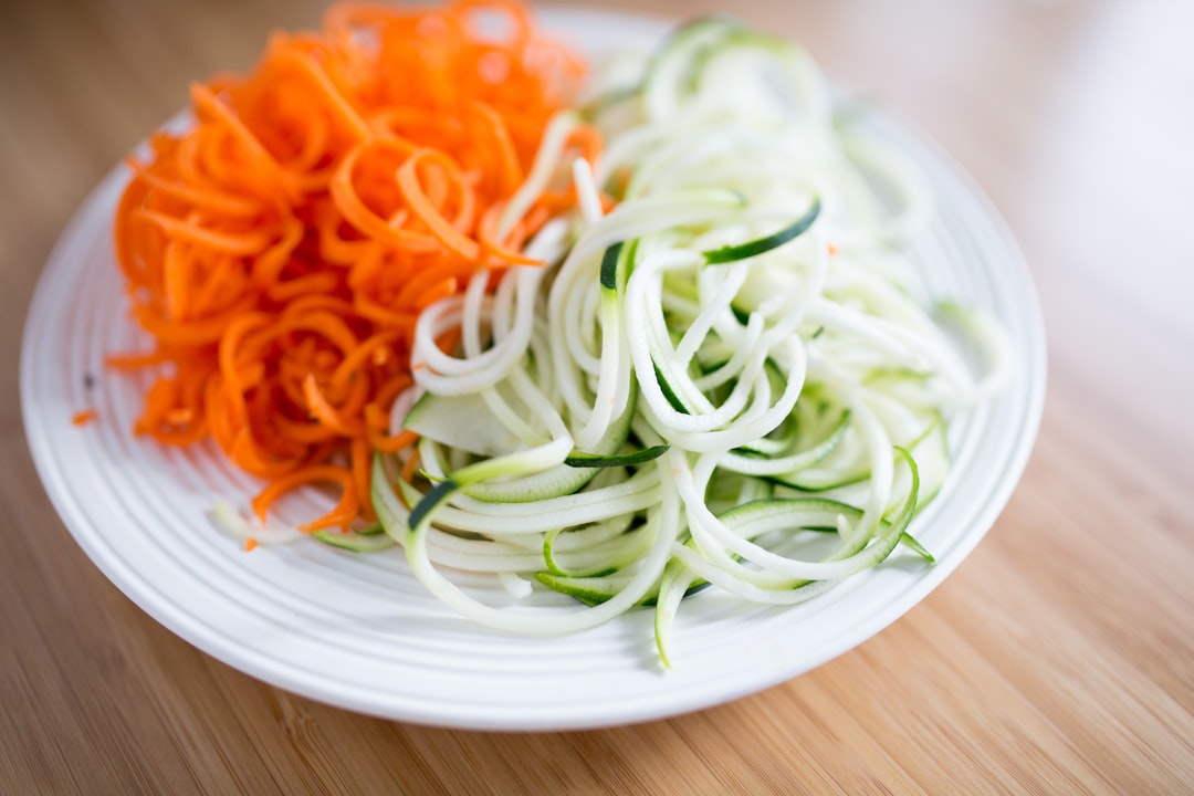 Fresh zucchini noodles made with a spiralizer, ready for a cold meal