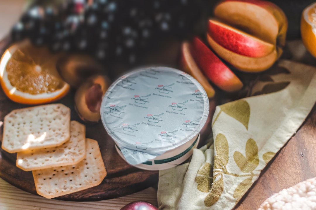 Beeswax wrap covering cheese and food on a countertop