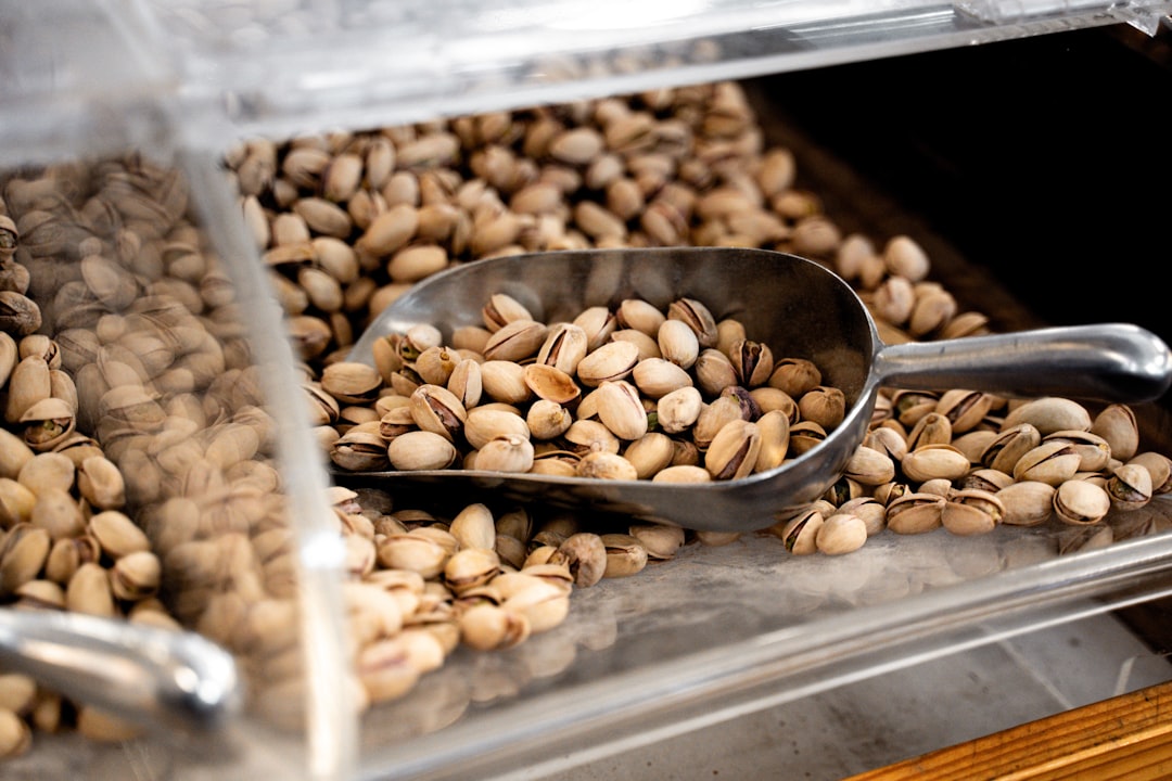 Bulk food storage containers with scoops in organized pantry
