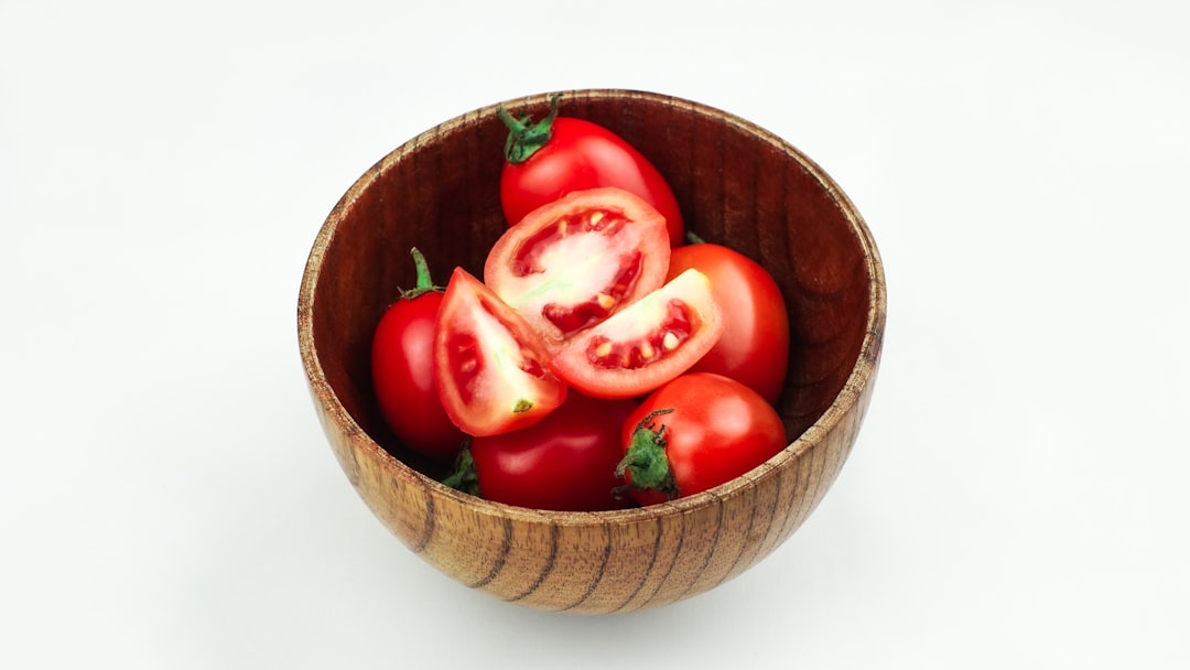 Fresh summer tomato salad in a rustic bowl