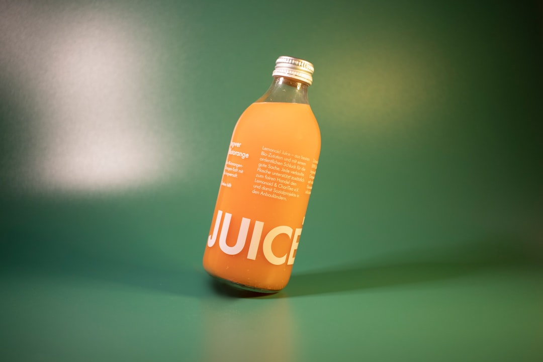 Masticating cold press juicer extracting green vegetable juice
